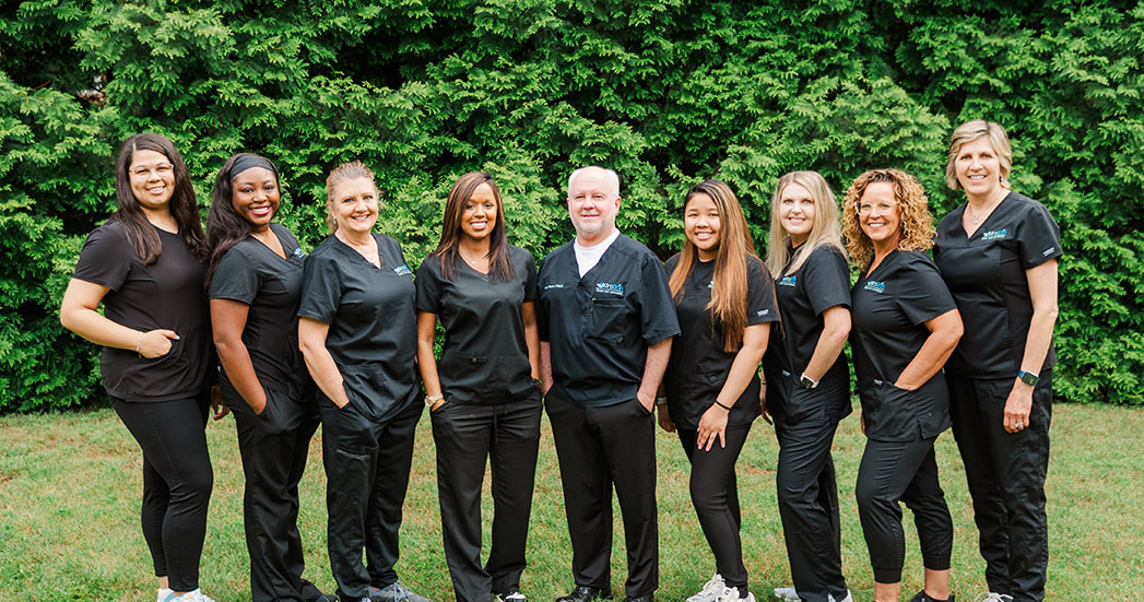 The ProGrin Riverside dental team smiling together